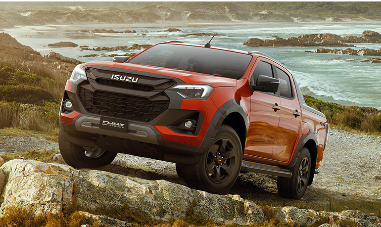 Isuzu D-MAX parked in between rocks