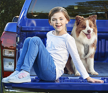 headshot of Brook Wayman sitting on a D-MAX